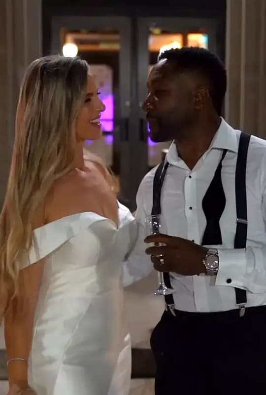 Annie & Knickoy standing outside of Liuna Station at the end of the night, enjoying a moment of peace and quiet, and a sip of champagne.